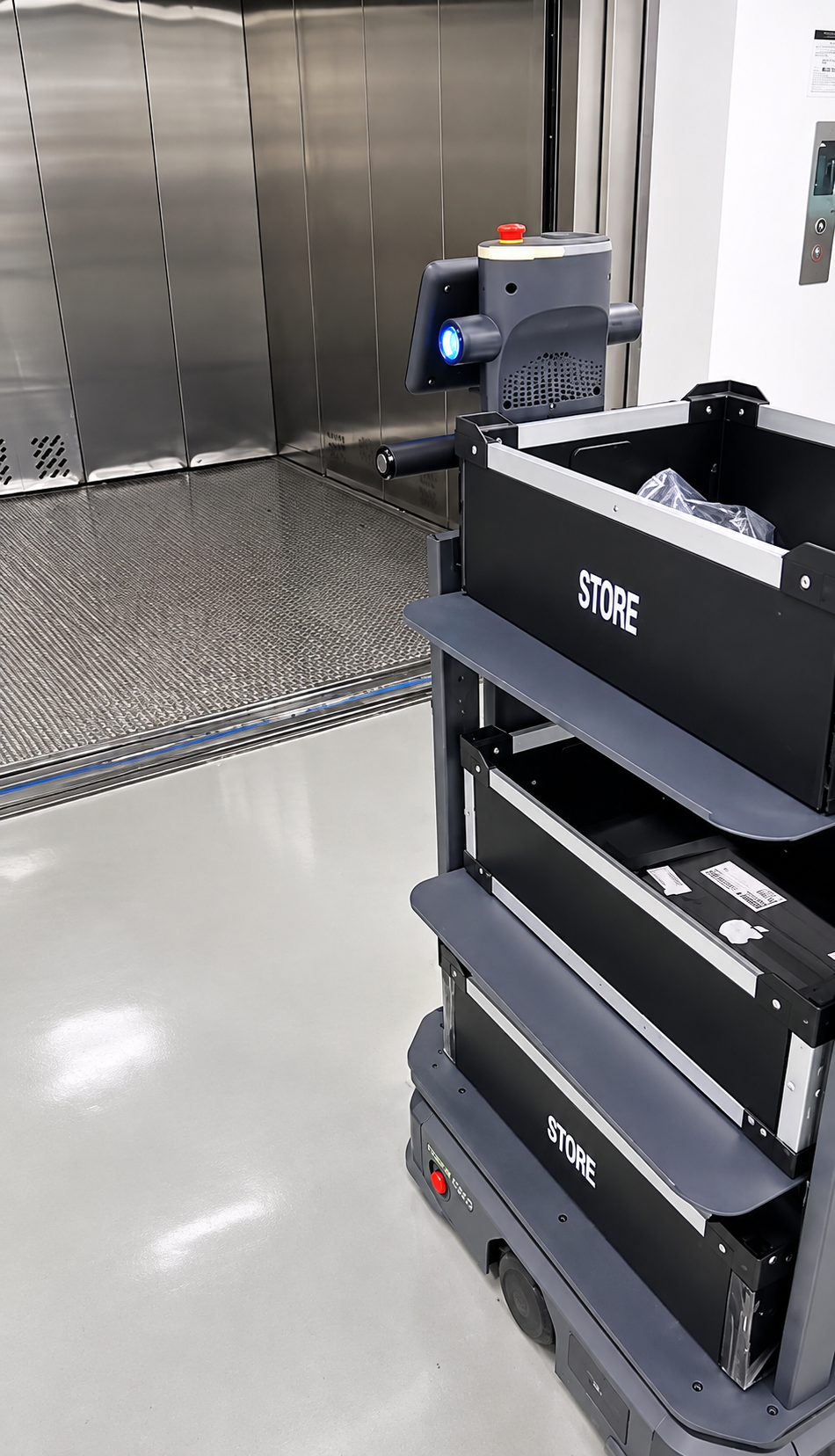 T300 Robot taking a factory elevator